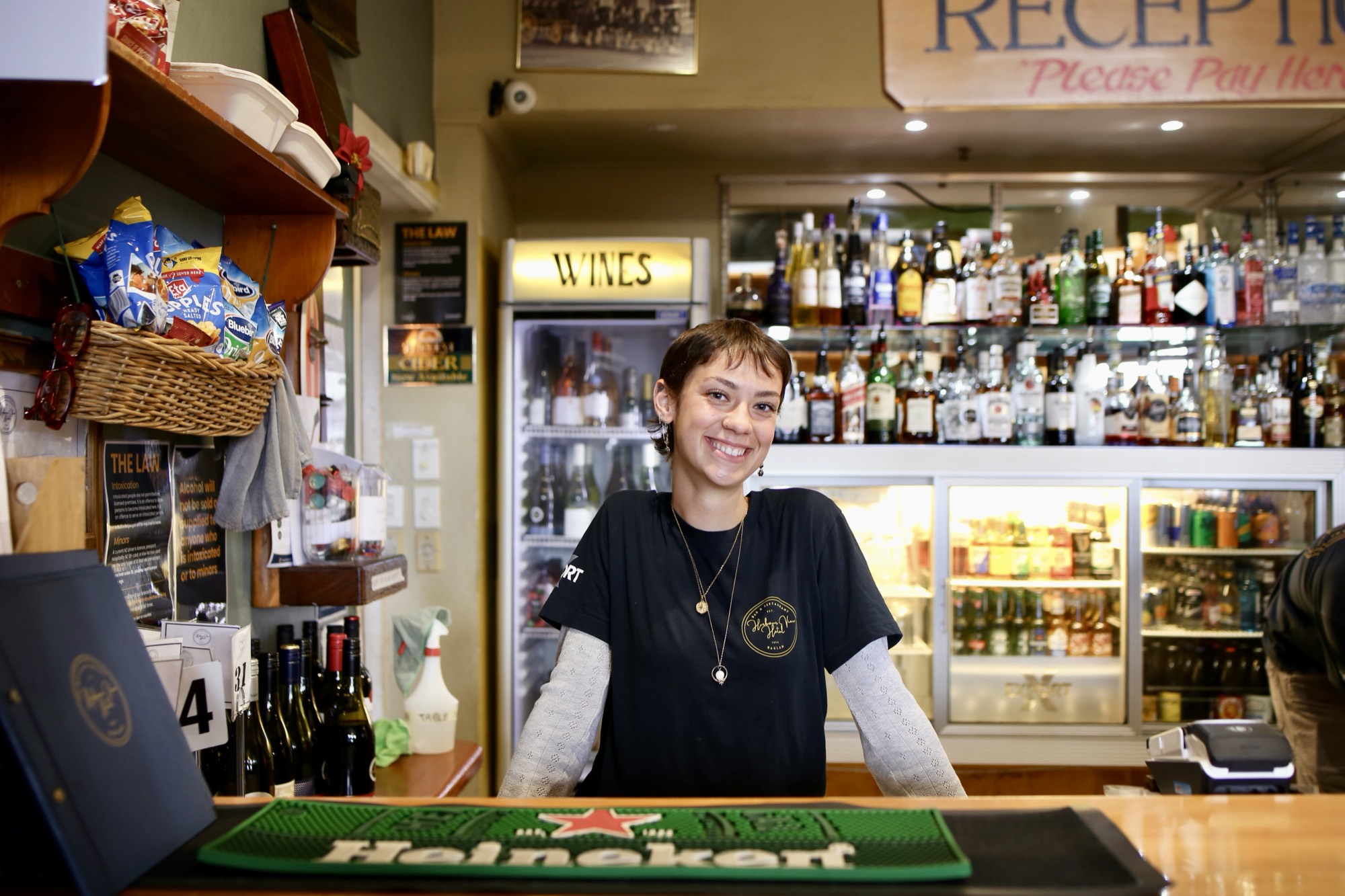 Harbour View Hotel staff member behind the Veranda Bar